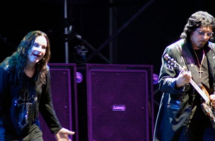 Ozzy Osborne and Tommy Iommi in a Black Sabbath concert.